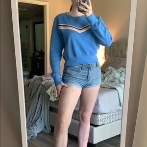 A super soft blue with a pink zigzag strip sweater